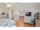 Main bedroom with dresser, closet, and mirrored sliding doors at 6375 Lolly Bay Ne Loop, Winter Haven, FL 33881