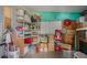 Storage area with shelves, boxes, and holiday decorations at 6375 Lolly Bay Ne Loop, Winter Haven, FL 33881