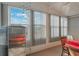 Sunroom with large windows, offering an abundance of natural light at 6375 Lolly Bay Ne Loop, Winter Haven, FL 33881