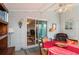 Sunroom with table, chairs, and access to the backyard at 6375 Lolly Bay Ne Loop, Winter Haven, FL 33881