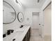 Double vanity bathroom with modern fixtures at 6455 Hemlock Rd, Ocala, FL 34472