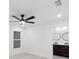 Spacious bedroom with ceiling fan and access to bathroom at 6455 Hemlock Rd, Ocala, FL 34472
