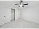 Bedroom with ceiling fan and closet at 6455 Hemlock Rd, Ocala, FL 34472