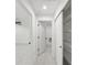 Bright hallway with tile flooring, storage and access to other rooms at 6455 Hemlock Rd, Ocala, FL 34472
