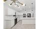 Modern kitchen with white cabinets, quartz countertops and stainless steel appliances at 6455 Hemlock Rd, Ocala, FL 34472