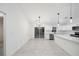 Modern kitchen with white cabinets, quartz countertops and stainless steel appliances at 6455 Hemlock Rd, Ocala, FL 34472
