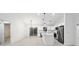 Modern kitchen with white cabinets, stainless steel appliances, and a large island at 6455 Hemlock Rd, Ocala, FL 34472