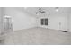 Bright and airy living room with tile flooring and a ceiling fan at 6455 Hemlock Rd, Ocala, FL 34472