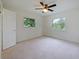 An empty bedroom with 2 windows for natural light and a ceiling fan at 647 Saranac Dr, Winter Springs, FL 32708
