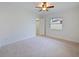 Bright bedroom with a ceiling fan and a walk-in closet with a window at 647 Saranac Dr, Winter Springs, FL 32708
