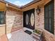 Close up of an inviting front entrance with double doors and updated hardware at 647 Saranac Dr, Winter Springs, FL 32708