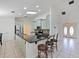 Bright kitchen features a large island with seating, stainless appliances, and lots of natural light at 647 Saranac Dr, Winter Springs, FL 32708
