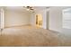 Expansive main bedroom suite with plush carpeting and double doors to the ensuite bathroom at 647 Saranac Dr, Winter Springs, FL 32708