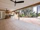Screened patio with an outdoor kitchen, ceiling fans, and access to the pool area at 647 Saranac Dr, Winter Springs, FL 32708