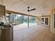 Covered patio and outdoor kitchen, perfect for entertaining by the pool at 647 Saranac Dr, Winter Springs, FL 32708