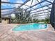 Sparkling screened-in pool surrounded by lush landscaping for ultimate privacy at 647 Saranac Dr, Winter Springs, FL 32708