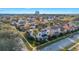 Aerial view of two story house with landscaped yard, in a neighborhood at 7400 Soiree Way, Reunion, FL 34747