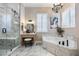 Spa-like bathroom with a walk-in shower and soaking tub at 7400 Soiree Way, Reunion, FL 34747