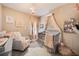 Adorable Bedroom with crib, seating, and charming decor at 7400 Soiree Way, Reunion, FL 34747