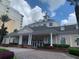 Community clubhouse with inviting entrance and landscaping at 7400 Soiree Way, Reunion, FL 34747