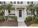Front porch with a hanging swing bed and a wreath on the door at 7400 Soiree Way, Reunion, FL 34747