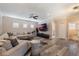Spacious Gathering room featuring L-shaped sofa and large TV at 7400 Soiree Way, Reunion, FL 34747