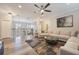 Open Gathering room showcasing a sectional sofa and balcony view at 7400 Soiree Way, Reunion, FL 34747