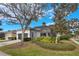 Single-story house with attached garage and landscaped yard at 7400 Soiree Way, Reunion, FL 34747