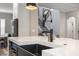 Modern kitchen sink and faucet with gold accents and marble countertops at 7400 Soiree Way, Reunion, FL 34747