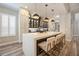 Elegant kitchen featuring a large marble island with seating and modern pendant lighting at 7400 Soiree Way, Reunion, FL 34747