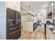 Modern kitchen with stainless steel refrigerator and white shaker cabinets at 7400 Soiree Way, Reunion, FL 34747