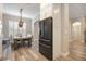 Modern kitchen with stainless steel refrigerator and white shaker cabinets at 7400 Soiree Way, Reunion, FL 34747