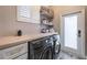 Convenient laundry room with washer, dryer, and extra storage at 7400 Soiree Way, Reunion, FL 34747