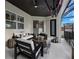 Covered patio with seating area, ceiling fan, and TV mount at 7400 Soiree Way, Reunion, FL 34747