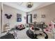 Fun playroom with a playpen, toys and Mickey Mouse decor at 7400 Soiree Way, Reunion, FL 34747