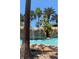 Resort-style pool with waterfall feature and lush landscaping at 7400 Soiree Way, Reunion, FL 34747