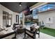Outdoor living space with pool, covered patio, and TV at 7400 Soiree Way, Reunion, FL 34747
