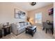 Cozy sitting room with comfy sofa and home office space at 7400 Soiree Way, Reunion, FL 34747