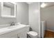 Bathroom with white vanity, toilet and laundry area at 7474 Canford Ct # 13, Winter Park, FL 32792