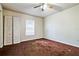 Well-lit bedroom with brown carpet and double door closet at 785 Nw 67Th St, Ocala, FL 34475