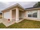 Front exterior view of a house with a garage and yard at 785 Nw 67Th St, Ocala, FL 34475