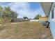 Large backyard with a wooden fence and AC unit at 8465 Oak Bluff Dr, Orlando, FL 32827
