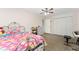 Charming bedroom with a floral bedspread and ample closet space at 8465 Oak Bluff Dr, Orlando, FL 32827