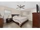 Main bedroom with king-size bed and an ensuite bathroom at 8465 Oak Bluff Dr, Orlando, FL 32827