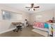 Spacious bedroom with two beds and plenty of natural light at 8465 Oak Bluff Dr, Orlando, FL 32827