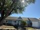 Charming single-story home with a well-manicured lawn, inviting entrance, and attached garage at 8465 Oak Bluff Dr, Orlando, FL 32827