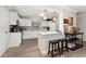 White kitchen with stainless steel appliances and quartz countertops at 8465 Oak Bluff Dr, Orlando, FL 32827