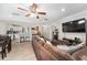 Open concept living and dining area with a brown sectional sofa at 8465 Oak Bluff Dr, Orlando, FL 32827