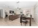 Bright living room with hardwood floors and dining area at 8465 Oak Bluff Dr, Orlando, FL 32827
