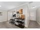 Open concept living space with kitchen view and hardwood floors at 8465 Oak Bluff Dr, Orlando, FL 32827